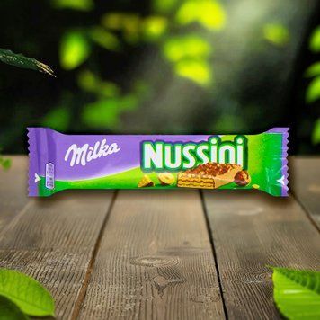 Шоколадний батончик молочний Нуссіні фундук 31г Milka Kraft 1/18463 фото